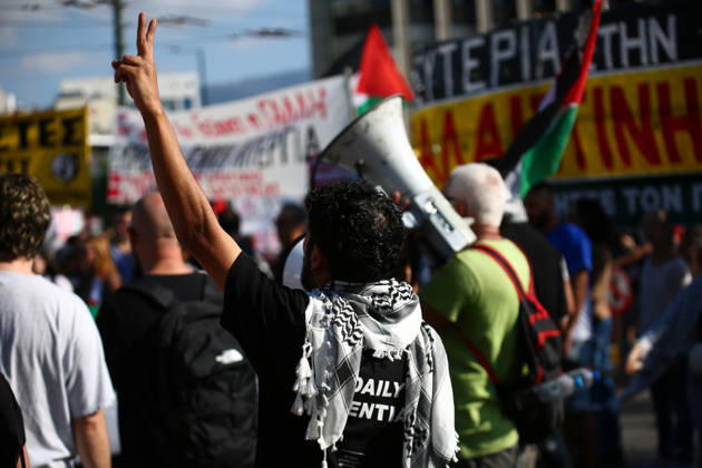 October 10, 2026, Athens, Attica, GREECE: A demonstrator wearing a Palestinian keffiyeh raises a victory sign during a pro-Palestinian protest. Athens GREECE - ZUMAx103 20261010_zip_x103_028 Copyright: xHarrisxXanthopoulosx