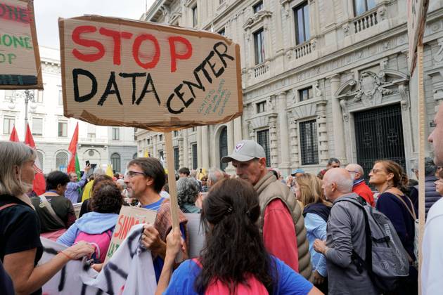 October 10, 2026, Milan, Italy: MILAN, ITALY Ã¢â‚¬ OCTOBER 10, 2026: Protesters gather for a sit-in in Piazza della Scala in central Milan to oppose the development of new data centers across Lombardy and Italy. The demonstration is organized by the Rete dei Comitati No Data Center (No Data Center Committee Network), which is calling for a moratorium on permits for new facilities. The group also urges public authorities to conduct thorough environmental, urban planning and regional assessments before approving projects. For approved facilities that have not yet begun operating, campaigners are calling for reviews to be reopened if potential microclimate effects and cumulative impacts with existing facilities were not adequately assessed.  - ZUMAq101 20261010_zna_q101_176 Copyright: xCalogeroxRussox