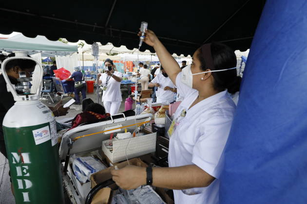 (261010) -- PENONOME, Oct. 10, 2026 -- Patients receive treatment at a temporary shelter after being evacuated from a damaged hospital in Penonome, Panama, Oct. 10, 2026. Panama declared a state of emergency on Saturday to coordinate relief efforts and assist communities affected by a powerful earthquake that struck the country Friday. (Photo by Xinhua) PANAMA-PENONOME-EARTHQUAKE-AFTERMATH DanielxGonzalez 