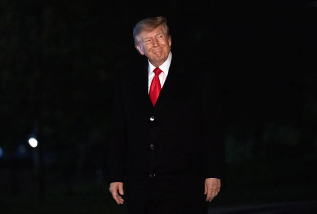 DC: Trump Returns from Clarksville, TN United States President Donald J Trump smiles at the media as he walks to the residence on the South Lawn of the White House in Washington, DC, USA, from Clarksville, Tennessee, following a campaign rally for Tennessee Republican candidates on the ballot in November, on Saturday, October 10, 2026. Credit: Ron Sachs Pool via CNP Washington District of Columbia United States  Copyright: xPool ABACAx