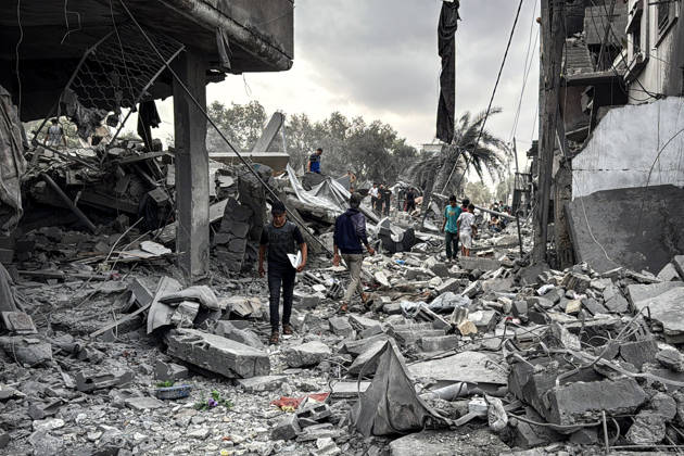 Palestinians Inspect Damage After Strike in Deir al-Balah Palestinians inspect their belongings amid the rubble of damaged residential buildings and their displacement tents after an Israeli airstrike targeted a house in Deir al-Balah, in the central Gaza Strip, on October 11, 2026. Photo by Ahmed Ibrahim apaimages Deir al-Balah Gaza Palestinian Territory 111026_Deir_al-Balah_AI_00(1) Copyright: xapaimagesxAhmedxIbrahimx xapaimagesx