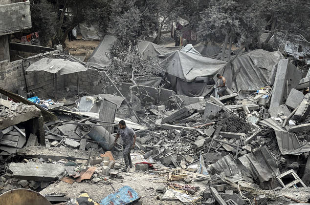 Palestinians Inspect Damage After Strike in Deir al-Balah Palestinians inspect their belongings amid the rubble of damaged residential buildings and their displacement tents after an Israeli airstrike targeted a house in Deir al-Balah, in the central Gaza Strip, on October 11, 2026. Photo by Ahmed Ibrahim apaimages Deir al-Balah Gaza Palestinian Territory 111026_Deir_al-Balah_AI_00(10) Copyright: xapaimagesxAhmedxIbrahimx xapaimagesx