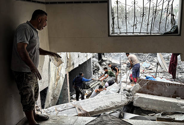 Palestinians Inspect Damage After Strike in Deir al-Balah Palestinians inspect their belongings amid the rubble of damaged residential buildings and their displacement tents after an Israeli airstrike targeted a house in Deir al-Balah, in the central Gaza Strip, on October 11, 2026. Photo by Ahmed Ibrahim apaimages Deir al-Balah Gaza Palestinian Territory 111026_Deir_al-Balah_AI_00(11) Copyright: xapaimagesxAhmedxIbrahimx xapaimagesx