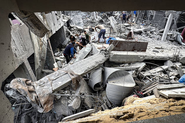Palestinians Inspect Damage After Strike in Deir al-Balah Palestinians inspect their belongings amid the rubble of damaged residential buildings and their displacement tents after an Israeli airstrike targeted a house in Deir al-Balah, in the central Gaza Strip, on October 11, 2026. Photo by Ahmed Ibrahim apaimages Deir al-Balah Gaza Palestinian Territory 111026_Deir_al-Balah_AI_00(13) Copyright: xapaimagesxAhmedxIbrahimx xapaimagesx