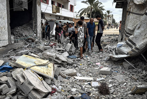 Palestinians Inspect Damage After Strike in Deir al-Balah Palestinians inspect their belongings amid the rubble of damaged residential buildings and their displacement tents after an Israeli airstrike targeted a house in Deir al-Balah, in the central Gaza Strip, on October 11, 2026. Photo by Ahmed Ibrahim apaimages Deir al-Balah Gaza Palestinian Territory 111026_Deir_al-Balah_AI_00(17) Copyright: xapaimagesxAhmedxIbrahimx xapaimagesx