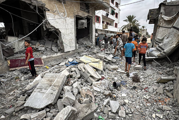 Palestinians Inspect Damage After Strike in Deir al-Balah Palestinians inspect their belongings amid the rubble of damaged residential buildings and their displacement tents after an Israeli airstrike targeted a house in Deir al-Balah, in the central Gaza Strip, on October 11, 2026. Photo by Ahmed Ibrahim apaimages Deir al-Balah Gaza Palestinian Territory 111026_Deir_al-Balah_AI_00(18) Copyright: xapaimagesxAhmedxIbrahimx xapaimagesx