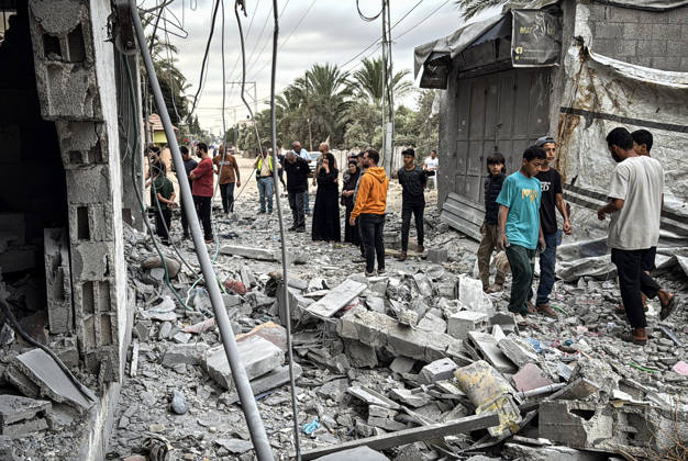 Palestinians Inspect Damage After Strike in Deir al-Balah Palestinians inspect their belongings amid the rubble of damaged residential buildings and their displacement tents after an Israeli airstrike targeted a house in Deir al-Balah, in the central Gaza Strip, on October 11, 2026. Photo by Ahmed Ibrahim apaimages Deir al-Balah Gaza Palestinian Territory 111026_Deir_al-Balah_AI_00(2) Copyright: xapaimagesxAhmedxIbrahimx xapaimagesx
