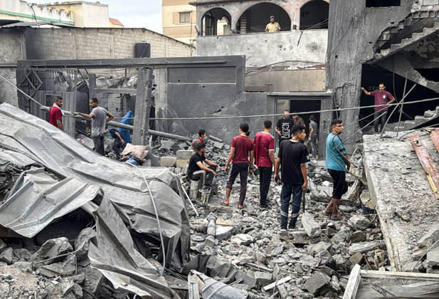 Palestinians Inspect Damage After Strike in Deir al-Balah Palestinians inspect their belongings amid the rubble of damaged residential buildings and their displacement tents after an Israeli airstrike targeted a house in Deir al-Balah, in the central Gaza Strip, on October 11, 2026. Photo by Ahmed Ibrahim apaimages Deir al-Balah Gaza Palestinian Territory 111026_Deir_al-Balah_AI_00(23) Copyright: xapaimagesxAhmedxIbrahimx xapaimagesx