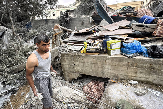 Palestinians Inspect Damage After Strike in Deir al-Balah Palestinians inspect their belongings amid the rubble of damaged residential buildings and their displacement tents after an Israeli airstrike targeted a house in Deir al-Balah, in the central Gaza Strip, on October 11, 2026. Photo by Ahmed Ibrahim apaimages Deir al-Balah Gaza Palestinian Territory 111026_Deir_al-Balah_AI_00(24) Copyright: xapaimagesxAhmedxIbrahimx xapaimagesx