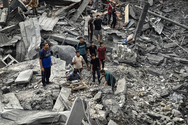 Palestinians Inspect Damage After Strike in Deir al-Balah Palestinians inspect their belongings amid the rubble of damaged residential buildings and their displacement tents after an Israeli airstrike targeted a house in Deir al-Balah, in the central Gaza Strip, on October 11, 2026. Photo by Ahmed Ibrahim apaimages Deir al-Balah Gaza Palestinian Territory 111026_Deir_al-Balah_AI_00(3) Copyright: xapaimagesxAhmedxIbrahimx xapaimagesx