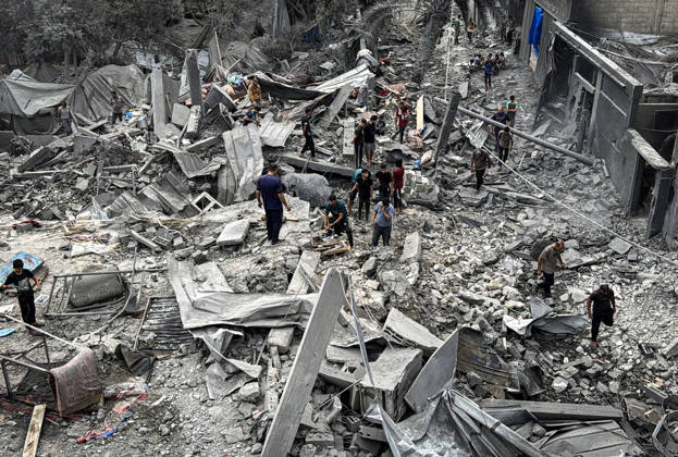 Palestinians Inspect Damage After Strike in Deir al-Balah Palestinians inspect their belongings amid the rubble of damaged residential buildings and their displacement tents after an Israeli airstrike targeted a house in Deir al-Balah, in the central Gaza Strip, on October 11, 2026. Photo by Ahmed Ibrahim apaimages Deir al-Balah Gaza Palestinian Territory 111026_Deir_al-Balah_AI_00(7) Copyright: xapaimagesxAhmedxIbrahimx xapaimagesx