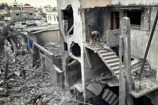 Palestinians Inspect Damage After Strike in Deir al-Balah Palestinians inspect their belongings amid the rubble of damaged residential buildings and their displacement tents after an Israeli airstrike targeted a house in Deir al-Balah, in the central Gaza Strip, on October 11, 2026. Photo by Ahmed Ibrahim apaimages Deir al-Balah Gaza Palestinian Territory 111026_Deir_al-Balah_AI_00(9) Copyright: xapaimagesxAhmedxIbrahimx xapaimagesx