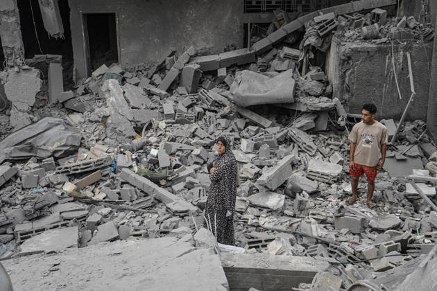 Israeli attack on Az-Zawayda area in Gaza DEIR AL-BALAH, GAZA, PALESTINE - OCTOBER 11: People search through the rubble of a building belonging to the Buheysi family following an Israeli airstrike in the town of Az-Zawayda, near Deir al-Balah in the central Gaza Strip, on October 11, 2026. Israeli forces carried out the strike despite the ceasefire, destroying the building and damaging surrounding structures. Adam Bilal Anadolu Deir Al-Balah Gaza. Editorial use only. Please get in touch for any other usage.  Copyright: x2026xAnadoluxAdamxBilalx
