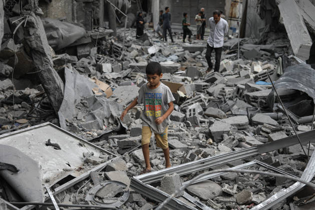 Israeli attack on Az-Zawayda area in Gaza DEIR AL-BALAH, GAZA, PALESTINE - OCTOBER 11: A Palestinian boy walks among the rubble of destroyed buildings following an Israeli airstrike targeting a building belonging to the Buheysi family in the town of Az-Zawayda, near Deir al-Balah in the central Gaza Strip, on October 11, 2026. Israeli forces carried out the strike despite the ceasefire, destroying the targeted building and damaging surrounding structures. Adam Bilal Anadolu Deir Al-Balah Gaza. Editorial use only. Please get in touch for any other usage.  Copyright: x2026xAnadoluxAdamxBilalx
