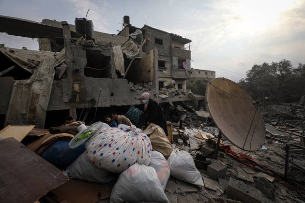 Palestinians Inspect Damage After Strike in Al-Zawayda Palestinians inspect their belongings amid the rubble of damaged residential buildings after an Israeli airstrike targeted a residential block in Al-Zawayda, in the central Gaza Strip, on October 11, 2026. Photo by Moiz Salhi apaimages Nusairat Gaza Strip Palestinian Territory 111026_Al-Zawayda_MS_00(40) Copyright: xapaimagesxMoizxSalhixx xapaimagesx