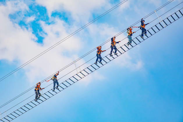 China Sky Ladder Challenger Tourists climb up a 250-meter-long soft ladder between two mountains in Mingtangshan Scenic Area in Yuexi county in central China s Anhui province, Sunday, Oct. 11, 2026. The rope ladder has 620 steps and a vertical distance of 365 meters. It opened to tourists in June this year, and quickly became a tourist attraction., Credit:stringer Utuku Feature China Avalon CHINA, ANHUI, YUEXI  Copyright: xstringerx xUtuku FeaturexChinax xAvalonx 1142342703