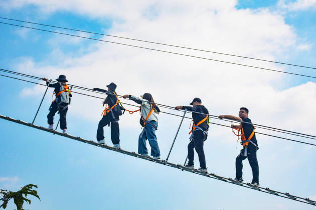 China Sky Ladder Challenger Tourists climb up a 250-meter-long soft ladder between two mountains in Mingtangshan Scenic Area in Yuexi county in central China s Anhui province, Sunday, Oct. 11, 2026. The rope ladder has 620 steps and a vertical distance of 365 meters. It opened to tourists in June this year, and quickly became a tourist attraction., Credit:stringer Utuku Feature China Avalon CHINA, ANHUI, YUEXI  Copyright: xstringerx xUtuku FeaturexChinax xAvalonx 1142342740