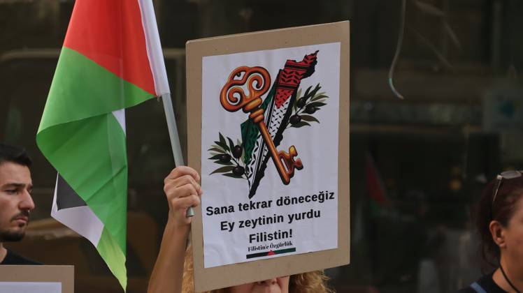 October 11, 2026, Â°Zmir, ToÂ¼rkiye: IZMIR, TURKEY, OCTOBER 11, 2026: Pro-Palestinian demonstrators gather outside the Turkan Saylan Cultural Center in Izmir during a protest organized by the local branch of the Association for the Freedom of Palestinians. Participants condemn Israeli military operations in Gaza and criticize US support for Israel, calling attention to Palestinian civilian casualties since October 7, 2023. The demonstration concludes at Gundogdu Square, where participants throw carnations into the sea in remembrance of Palestinians killed during the conflict. Â°Zmir Türkiye - ZUMAq101 20261011_zna_q101_105 Copyright: xTurgayxKilicx