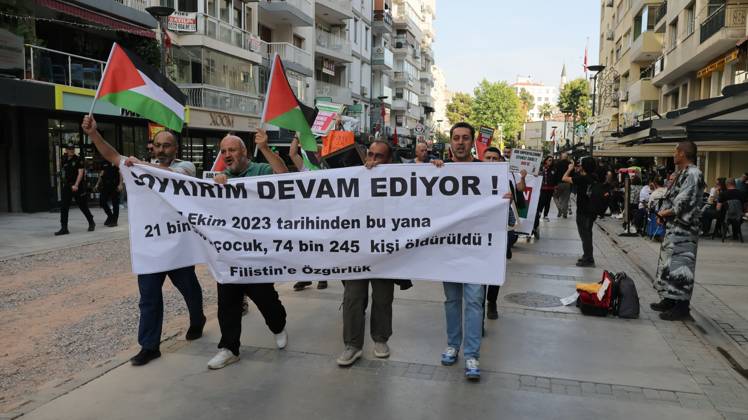 October 11, 2026, Â°Zmir, ToÂ¼rkiye: IZMIR, TURKEY, OCTOBER 11, 2026: Pro-Palestinian demonstrators gather outside the Turkan Saylan Cultural Center in Izmir during a protest organized by the local branch of the Association for the Freedom of Palestinians. Participants condemn Israeli military operations in Gaza and criticize US support for Israel, calling attention to Palestinian civilian casualties since October 7, 2023. The demonstration concludes at Gundogdu Square, where participants throw carnations into the sea in remembrance of Palestinians killed during the conflict. Â°Zmir Türkiye - ZUMAq101 20261011_zna_q101_115 Copyright: xTurgayxKilicx