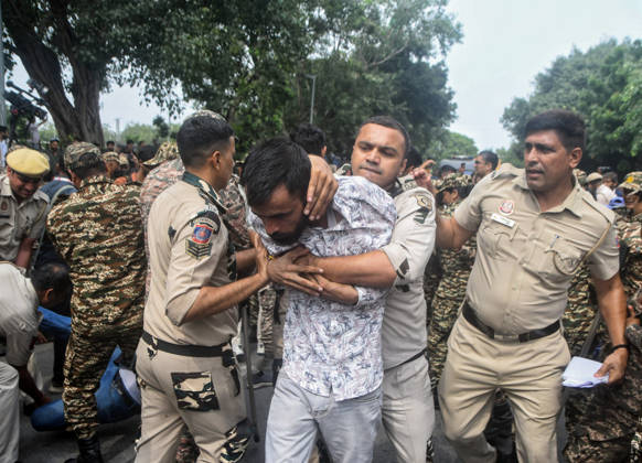 Workers of SFI, AISF and AIYF are being detained by Delhi Police while holding a protest against CEC Gyanesh Kumar at the Inner Circle of Connaught Place New Delhi, Oct 11 (ANI): Workers of SFI, AISF and AIYF are being detained by Delhi Police while holding a protest against CEC Gyanesh Kumar at the Inner Circle of Connaught Place, in New Delhi on Sunday. Delhi New Delhi India Copyright: xANIx ANI_20261011464