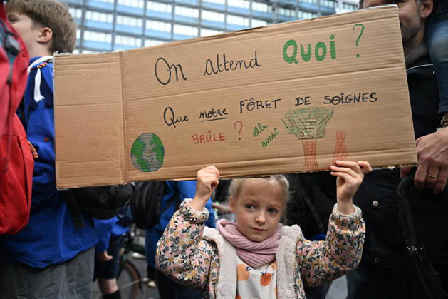 Tens of thousands march in Brussels demanding stronger climate action BRUSSELS, BELGIUM - OCTOBER 11: Demonstrators hold climate-themed placards as tens of thousands of people march through Brussels calling for stronger action against climate change and reduced dependence on fossil fuels, on October 11, 2026 in Brussels, Belgium. The protest was organized by the Belgian Climate Coalition, which brings together around 100 civil society organizations. Participants marched along major roads toward Schuman Square, home to several European Union institutions, while protesting the government s climate policies. Dursun Aydemir Anadolu Brussels Belgium. Editorial use only. Please get in touch for any other usage. Copyright: x2026xAnadoluxDursunxAydemirx