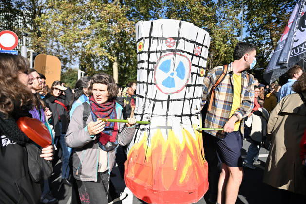 Tens of thousands march in Brussels demanding stronger climate action BRUSSELS, BELGIUM - OCTOBER 11: Demonstrators hold climate-themed placards as tens of thousands of people march through Brussels calling for stronger action against climate change and reduced dependence on fossil fuels, on October 11, 2026 in Brussels, Belgium. The protest was organized by the Belgian Climate Coalition, which brings together around 100 civil society organizations. Participants marched along major roads toward Schuman Square, home to several European Union institutions, while protesting the government s climate policies. Dursun Aydemir Anadolu Brussels Belgium. Editorial use only. Please get in touch for any other usage.  Copyright: x2026xAnadoluxDursunxAydemirx