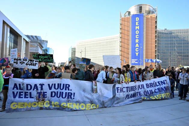 Tens of thousands march in Brussels demanding stronger climate action BRUSSELS, BELGIUM - OCTOBER 11: Demonstrators hold climate-themed placards as tens of thousands of people march through Brussels calling for stronger action against climate change and reduced dependence on fossil fuels, on October 11, 2026 in Brussels, Belgium. The protest was organized by the Belgian Climate Coalition, which brings together around 100 civil society organizations. Participants marched along major roads toward Schuman Square, home to several European Union institutions, while protesting the government s climate policies. Dursun Aydemir Anadolu Brussels Belgium. Editorial use only. Please get in touch for any other usage.  Copyright: x2026xAnadoluxDursunxAydemirx