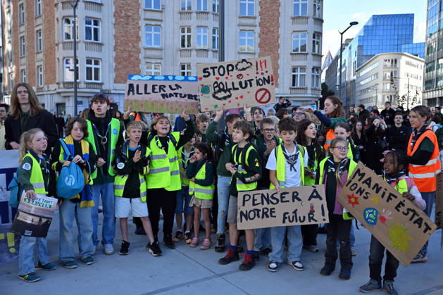 Tens of thousands march in Brussels demanding stronger climate action BRUSSELS, BELGIUM - OCTOBER 11: Demonstrators hold climate-themed placards as tens of thousands of people march through Brussels calling for stronger action against climate change and reduced dependence on fossil fuels, on October 11, 2026 in Brussels, Belgium. The protest was organized by the Belgian Climate Coalition, which brings together around 100 civil society organizations. Participants marched along major roads toward Schuman Square, home to several European Union institutions, while protesting the government s climate policies. Dursun Aydemir Anadolu Brussels Belgium. Editorial use only. Please get in touch for any other usage.  Copyright: x2026xAnadoluxDursunxAydemirx