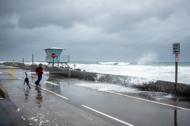 October 11, 2026, Oceanside, California, USA: An Oceanside man and his dog brave historic El NioÂ±o tidal swells on October 10, 2026. These Kelvin Waves have brought major damages to the Southern California coastline. Oceanside USA - ZUMAg219 20261011_znp_g219_009 Copyright: xJakexLeexGreenx