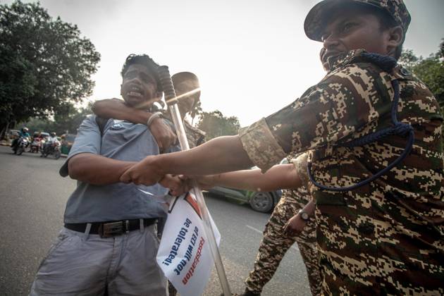Protest to demand resignation of India s chief election commissioner in New Delhi NEW DELHI, INDIA - OCTOBER 11: Indian police officers detain a protestor during a mass protest organized by the Cockroach Janta Party (CJP) in New Delhi, India on October 11, 2026. Demonstrators gathered to demand the resignation of Chief Election Commissioner Gyanesh Kumar over alleged electoral roll irregularities and revisions. Yousuf Sarfaraz Anadolu New Delhi India. Editorial use only. Please get in touch for any other usage.  Copyright: x2026xAnadoluxYousufxSarfarazx