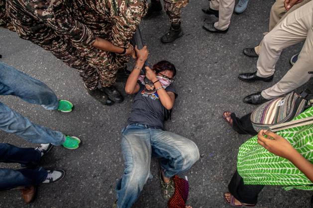 Protest to demand resignation of India s chief election commissioner in New Delhi NEW DELHI, INDIA - OCTOBER 11: Indian police officers detain a protestor during a mass protest organized by the Cockroach Janta Party (CJP) in New Delhi, India on October 11, 2026. Demonstrators gathered to demand the resignation of Chief Election Commissioner Gyanesh Kumar over alleged electoral roll irregularities and revisions. Yousuf Sarfaraz Anadolu New Delhi India. Editorial use only. Please get in touch for any other usage.  Copyright: x2026xAnadoluxYousufxSarfarazx