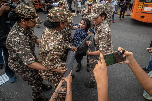 Protest to demand resignation of India s chief election commissioner in New Delhi NEW DELHI, INDIA - OCTOBER 11: Indian police officers detain a protestor during a mass protest organized by the Cockroach Janta Party (CJP) in New Delhi, India on October 11, 2026. Demonstrators gathered to demand the resignation of Chief Election Commissioner Gyanesh Kumar over alleged electoral roll irregularities and revisions. Yousuf Sarfaraz Anadolu New Delhi India. Editorial use only. Please get in touch for any other usage.  Copyright: x2026xAnadoluxYousufxSarfarazx