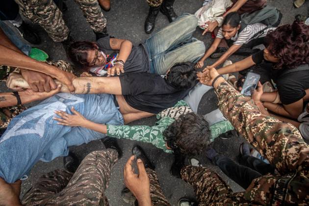 Protest to demand resignation of India s chief election commissioner in New Delhi NEW DELHI, INDIA - OCTOBER 11: Indian police officers detain a protestor during a mass protest organized by the Cockroach Janta Party (CJP) in New Delhi, India on October 11, 2026. Demonstrators gathered to demand the resignation of Chief Election Commissioner Gyanesh Kumar over alleged electoral roll irregularities and revisions. Yousuf Sarfaraz Anadolu New Delhi India. Editorial use only. Please get in touch for any other usage.  Copyright: x2026xAnadoluxYousufxSarfarazx