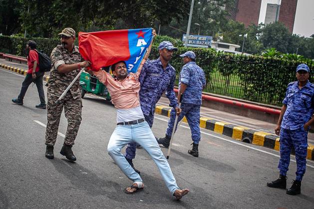 Protest to demand resignation of India s chief election commissioner in New Delhi NEW DELHI, INDIA - OCTOBER 11: Indian police officers detain a protestor during a mass protest organized by the Cockroach Janta Party (CJP) in New Delhi, India on October 11, 2026. Demonstrators gathered to demand the resignation of Chief Election Commissioner Gyanesh Kumar over alleged electoral roll irregularities and revisions. Yousuf Sarfaraz Anadolu New Delhi India. Editorial use only. Please get in touch for any other usage.  Copyright: x2026xAnadoluxYousufxSarfarazx