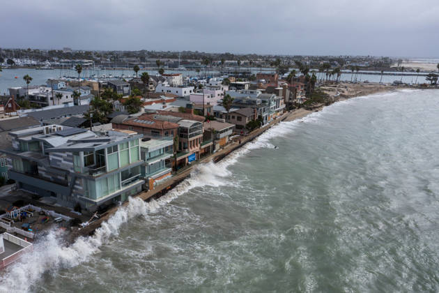 October 11, 2006, Long Beach, California, USA: The Long Beach Peninsula is facing severe, structural devastation as Tropical Storm Rachel batters the Southern California coast. Driven by a developing El Nino pattern, this is the fourth major storm system to slam the shoreline in six weeks. Waves and unusually high tides have shattered a 30-foot section of the protective wooden bulkhead, completely shredding the historic boardwalk and allowing seawater to surge directly onto interior streets. Flooding has swamped coastal neighborhoods, forcing mandatory evacuations along oceanfront blocks like Seaside Walk. Emergency crews are working to stack thousands of sandbags and reinforce coastal defenses, but city inspectors have already been forced - ZUMAr19_ 20261011_new_r19_124 Copyright: xRuaridhxStewartx