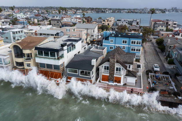 October 11, 2006, Long Beach, California, USA: The Long Beach Peninsula is facing severe, structural devastation as Tropical Storm Rachel batters the Southern California coast. Driven by a developing El Nino pattern, this is the fourth major storm system to slam the shoreline in six weeks. Waves and unusually high tides have shattered a 30-foot section of the protective wooden bulkhead, completely shredding the historic boardwalk and allowing seawater to surge directly onto interior streets. Flooding has swamped coastal neighborhoods, forcing mandatory evacuations along oceanfront blocks like Seaside Walk. Emergency crews are working to stack thousands of sandbags and reinforce coastal defenses, but city inspectors have already been forced - ZUMAr19_ 20261011_new_r19_121 Copyright: xRuaridhxStewartx