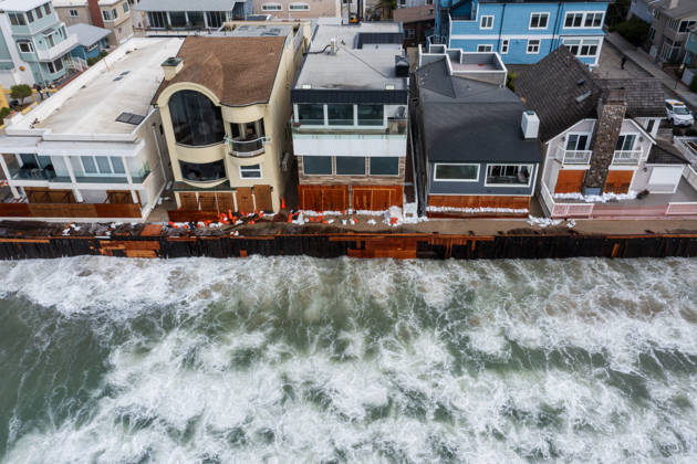 October 11, 2006, Long Beach, California, USA: The Long Beach Peninsula is facing severe, structural devastation as Tropical Storm Rachel batters the Southern California coast. Driven by a developing El Nino pattern, this is the fourth major storm system to slam the shoreline in six weeks. Waves and unusually high tides have shattered a 30-foot section of the protective wooden bulkhead, completely shredding the historic boardwalk and allowing seawater to surge directly onto interior streets. Flooding has swamped coastal neighborhoods, forcing mandatory evacuations along oceanfront blocks like Seaside Walk. Emergency crews are working to stack thousands of sandbags and reinforce coastal defenses, but city inspectors have already been forced - ZUMAr19_ 20261011_new_r19_122 Copyright: xRuaridhxStewartx
