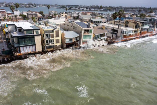 October 11, 2006, Long Beach, California, USA: The Long Beach Peninsula is facing severe, structural devastation as Tropical Storm Rachel batters the Southern California coast. Driven by a developing El Nino pattern, this is the fourth major storm system to slam the shoreline in six weeks. Waves and unusually high tides have shattered a 30-foot section of the protective wooden bulkhead, completely shredding the historic boardwalk and allowing seawater to surge directly onto interior streets. Flooding has swamped coastal neighborhoods, forcing mandatory evacuations along oceanfront blocks like Seaside Walk. Emergency crews are working to stack thousands of sandbags and reinforce coastal defenses, but city inspectors have already been forced - ZUMAr19_ 20261011_new_r19_138 Copyright: xRuaridhxStewartx