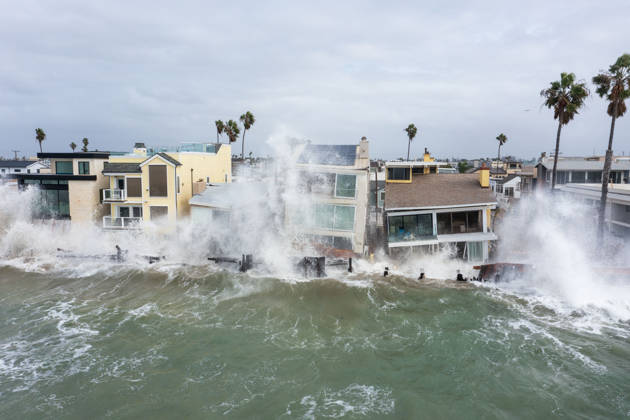October 11, 2006, Long Beach, California, USA: The Long Beach Peninsula is facing severe, structural devastation as Tropical Storm Rachel batters the Southern California coast. Driven by a developing El Nino pattern, this is the fourth major storm system to slam the shoreline in six weeks. Waves and unusually high tides have shattered a 30-foot section of the protective wooden bulkhead, completely shredding the historic boardwalk and allowing seawater to surge directly onto interior streets. Flooding has swamped coastal neighborhoods, forcing mandatory evacuations along oceanfront blocks like Seaside Walk. Emergency crews are working to stack thousands of sandbags and reinforce coastal defenses, but city inspectors have already been forced - ZUMAr19_ 20261011_new_r19_145 Copyright: xRuaridhxStewartx