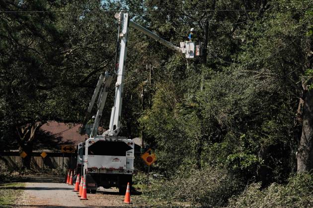 October 11, 2026, Pensacola, Florida, U.S: October 11, 2026 Pensacola, Florida USA: Line workers try and remove fallen tree limbs from power lines after the arrival of Hurricane Isaias. Pensacola U.S - ZUMAa14_ 20261011_zaf_a14_021 Copyright: xDanxAndersonx