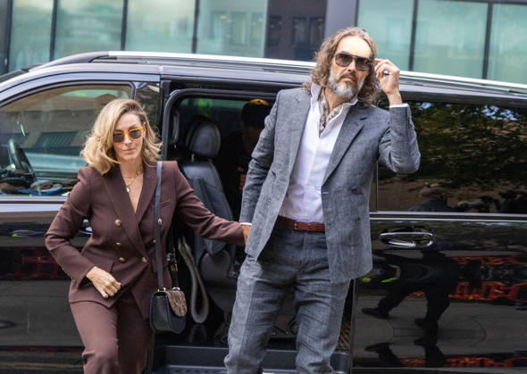 October 12, 2026, London, England, United Kingdom: RUSSELL BRAND with his wife LAURA arrives at Southwark Crown Court, where he is facing three charges of rape, indecent assault, and three counts of sexual assault, relating to six women. London United Kingdom - ZUMAs262 20261012_zip_s262_014 Copyright: xTayfunxSalcix