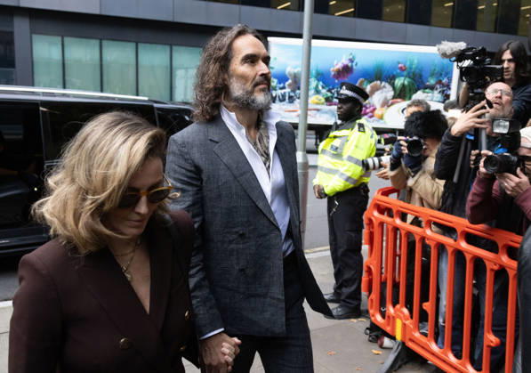 October 12, 2026, London, England, United Kingdom: RUSSELL BRAND with his wife LAURA arrives at Southwark Crown Court, where he is facing three charges of rape, indecent assault, and three counts of sexual assault, relating to six women. London United Kingdom - ZUMAs262 20261012_zip_s262_015 Copyright: xTayfunxSalcix