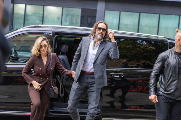 October 12, 2026, London, England, United Kingdom: RUSSELL BRAND with his wife LAURA arrives at Southwark Crown Court, where he is facing three charges of rape, indecent assault, and three counts of sexual assault, relating to six women. London United Kingdom - ZUMAs262 20261012_zip_s262_019 Copyright: xTayfunxSalcix