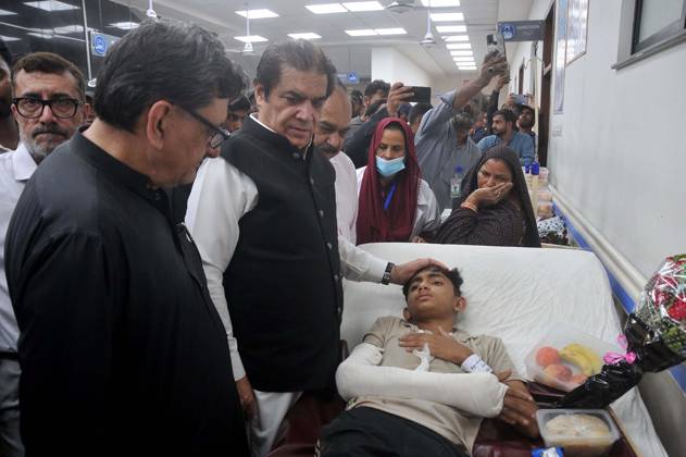 October 13, 2026, Pakistan: Federal Minister for Railways Muhammad Hanif Abbasi Visits Nishtar Hospital to Check on Injured Passenger After Rehman Baba Express Derailment Near Sher Shah Railway Station in Multan Pakistan  - ZUMAas3_ 20261013_zaf_as3_032 Copyright: xPPIx