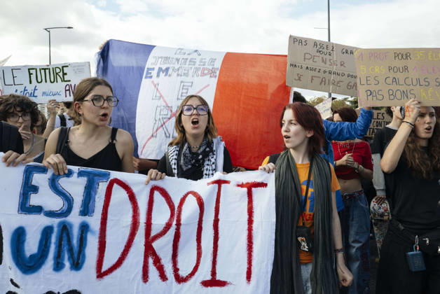 High School Student Mobilisation - Toulouse A blue, white and red flag bearing the slogan - La jeunesse emmerde le RN - in the midst of schoolgirls standing behind a banner. Act V of the secondary school and university students protests. Young people and the world of work are continuing their joint mobilisation and demands for adequate resources for education, better study conditions, an end to student precariousness, and access to housing. France, Toulouse, 13 October 2026. Photo by Patricia Huchot-Boissier AbacaPress.com. TOULOUSE OCCITANIE France  Copyright: xHuchot-BoissierxPatricia ABACAx