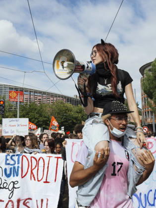 High School Student Mobilisation - Toulouse The procession moves forward, with a young woman holding a megaphone standing on the shoulders of a protester. Act V of the secondary school and university students protests. Young people and the world of work are continuing their joint mobilisation and demands for adequate resources for education, better study conditions, an end to student precariousness, and access to housing. France, Toulouse, 13 October 2026. Photo by Patricia Huchot-Boissier AbacaPress.com. TOULOUSE OCCITANIE France  Copyright: xHuchot-BoissierxPatricia ABACAx