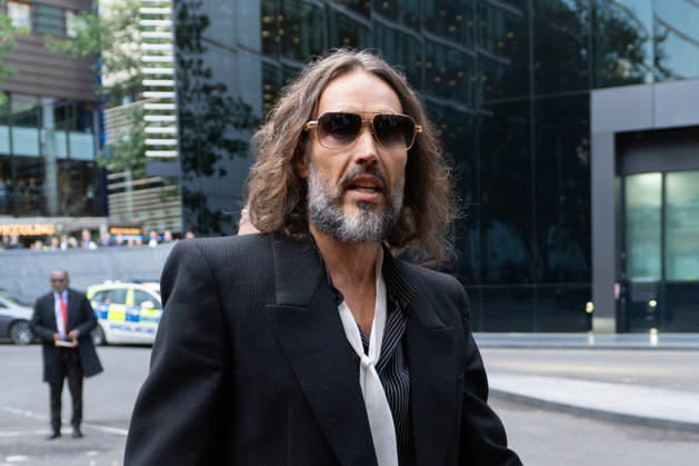 October 14, 2026, London, England, United Kingdom: Actor and comedian RUSSELL BRAND arrives at Southwark Crown Court in London, as his trial on charges of rape, sexual assault and indecent assault continues. Brand has pleaded not guilty to all charges. London United Kingdom - ZUMAk172 20261014_zip_k172_004 Copyright: xThomasxKrychx