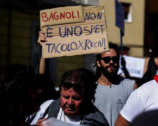 IPA89763015 - NAPLES, ITALY — OCTOBER 16, 2026: Environmental activists, students, and unemployed people take to the streets in the Bagnoli district of Naples to protest the city government’s handling of the environmental remediation of the former Italsider steelworks site. The demonstration focuses on the ongoing redevelopment work in the area, where facilities for the 38th Louis Vuitton America’s Cup—scheduled to take place in Naples in 2027—are being built. Protesters raise concerns about environmental protection, the remediation process, and the project’s impact on the local community.  Copyright: xAntonioxBalasco LiveMediax xAntonioxBalasco LiveMediax IPA89763015