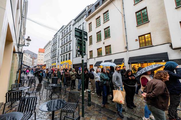 People pictured in the queue ahead of the Angele Instinct Release Party , a surprise party organized by the Brussels singer to celebrate the release of her album Instinct at the Grote Markt Grand Place, in Brussels, Friday 16 October 2026.  EMILExWINDAL 190006189