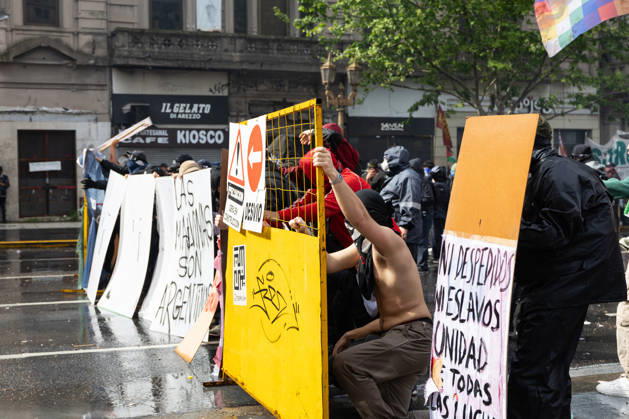 October 16, 2026, Buenos Aires, Buenos Aires, Argentina: Protesters stand behind a barricade during clashes with police. Buenos Aires Argentina - ZUMAp265 20261016_zip_p265_040 Copyright: xDelfinaxCorberaxPix
